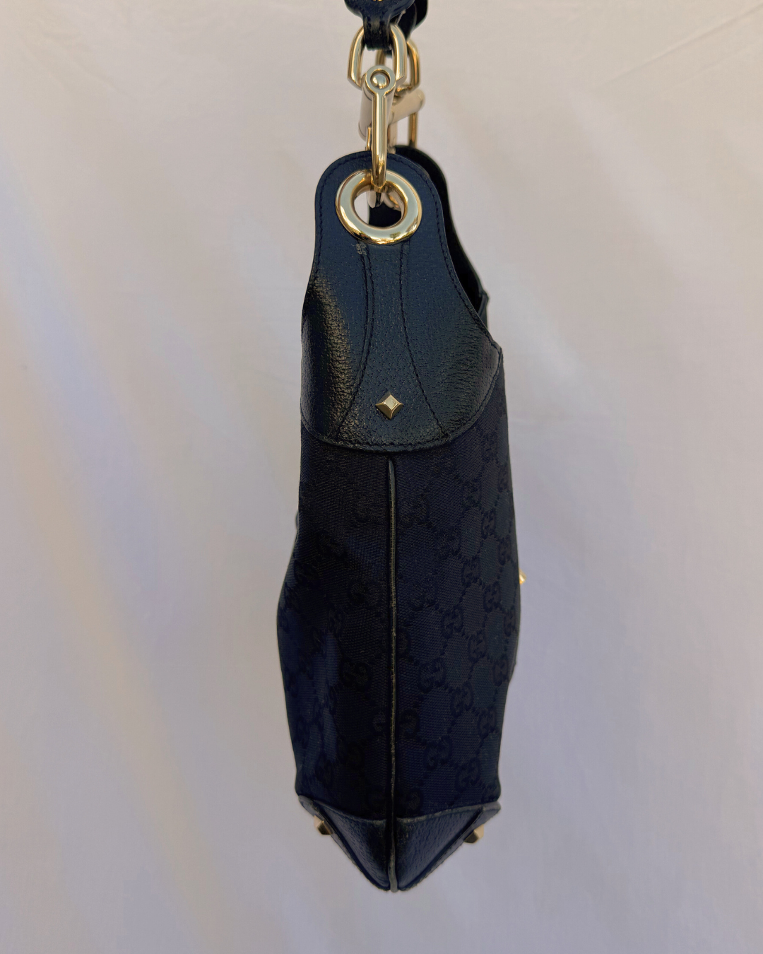 Black canvas and leather handbag on a white background