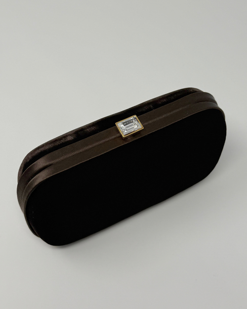 Brown velvet vintage clutch bag with a diamond clasp on a white background