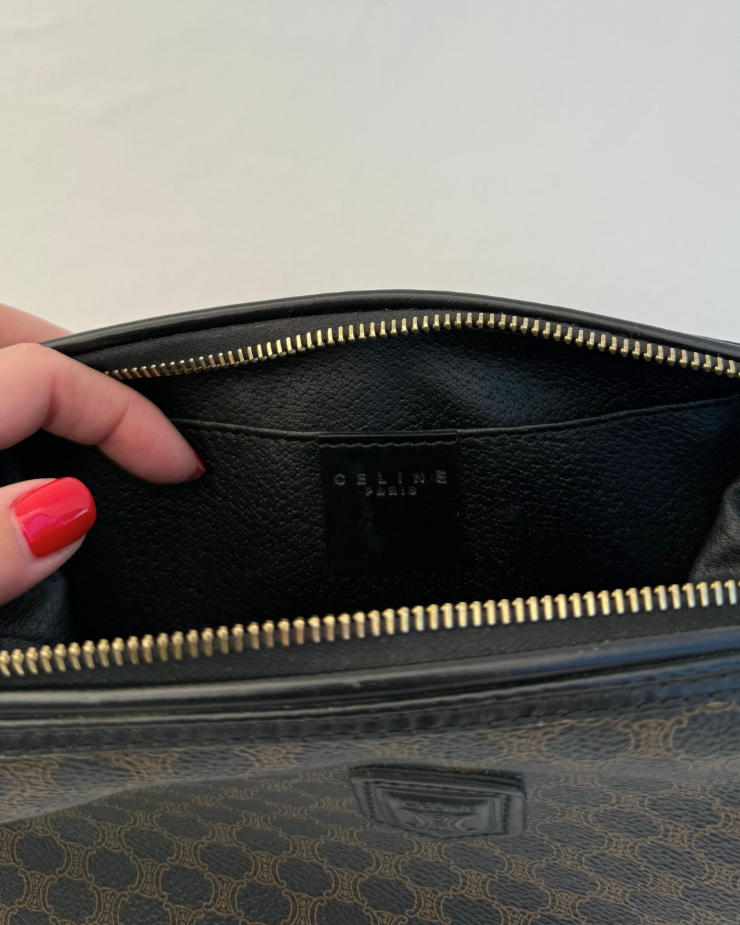 Inside view of Celine Vintage Macadam Portfolio Brown Cosmetic Bag leather lining on white background