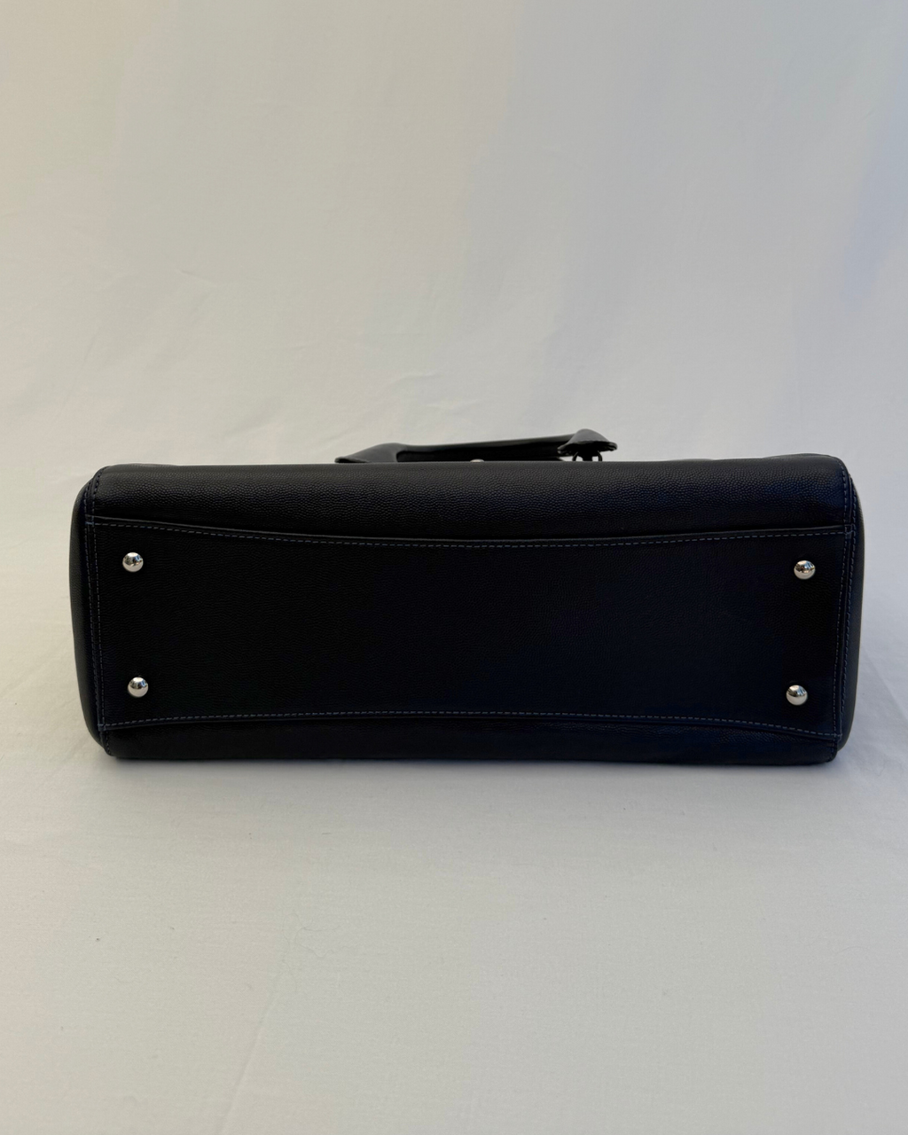 Bottom angle of the Chanel 2015 Medium Executive Cerf Caviar Leather Tote Bag Navy Blue Vintage