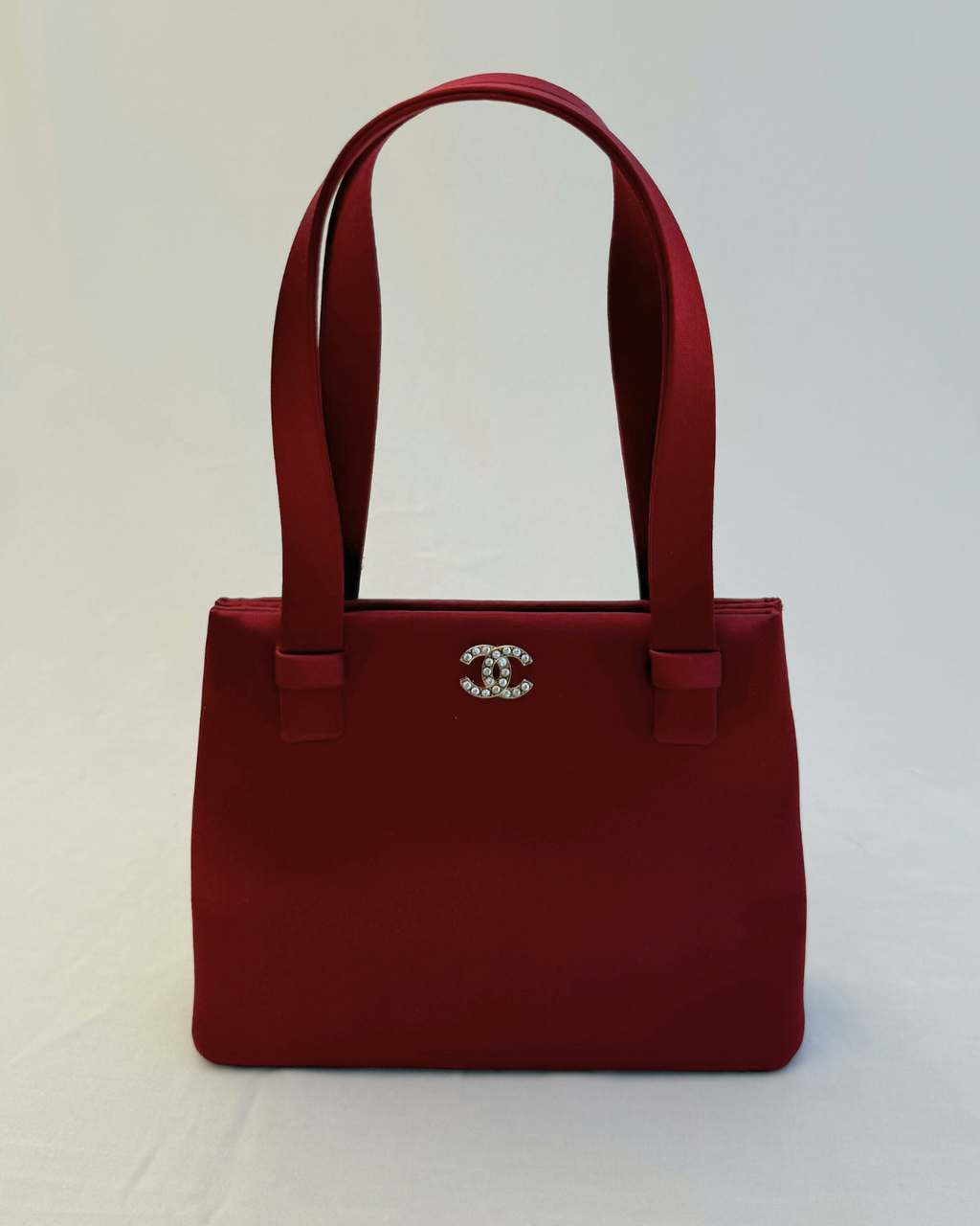 Front view of Chanel Rare Vintage 1990's Red Satin Evening Bag vintage handbag on white background
