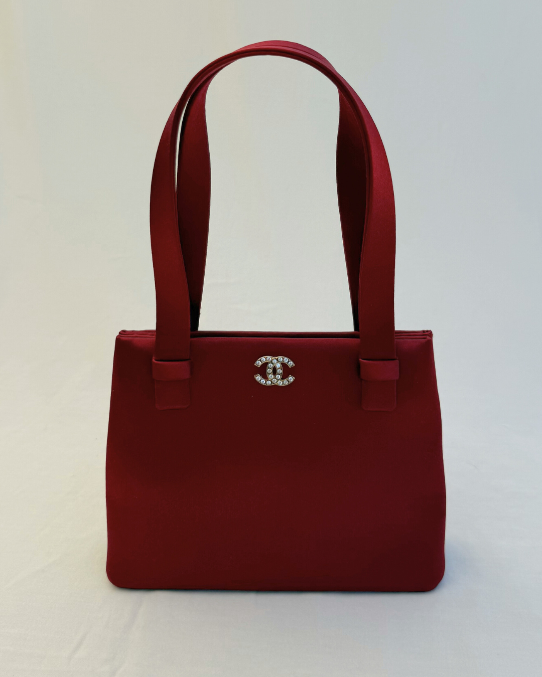 Front view of Chanel Rare Vintage 1990's Red Satin Evening Bag vintage handbag on white background