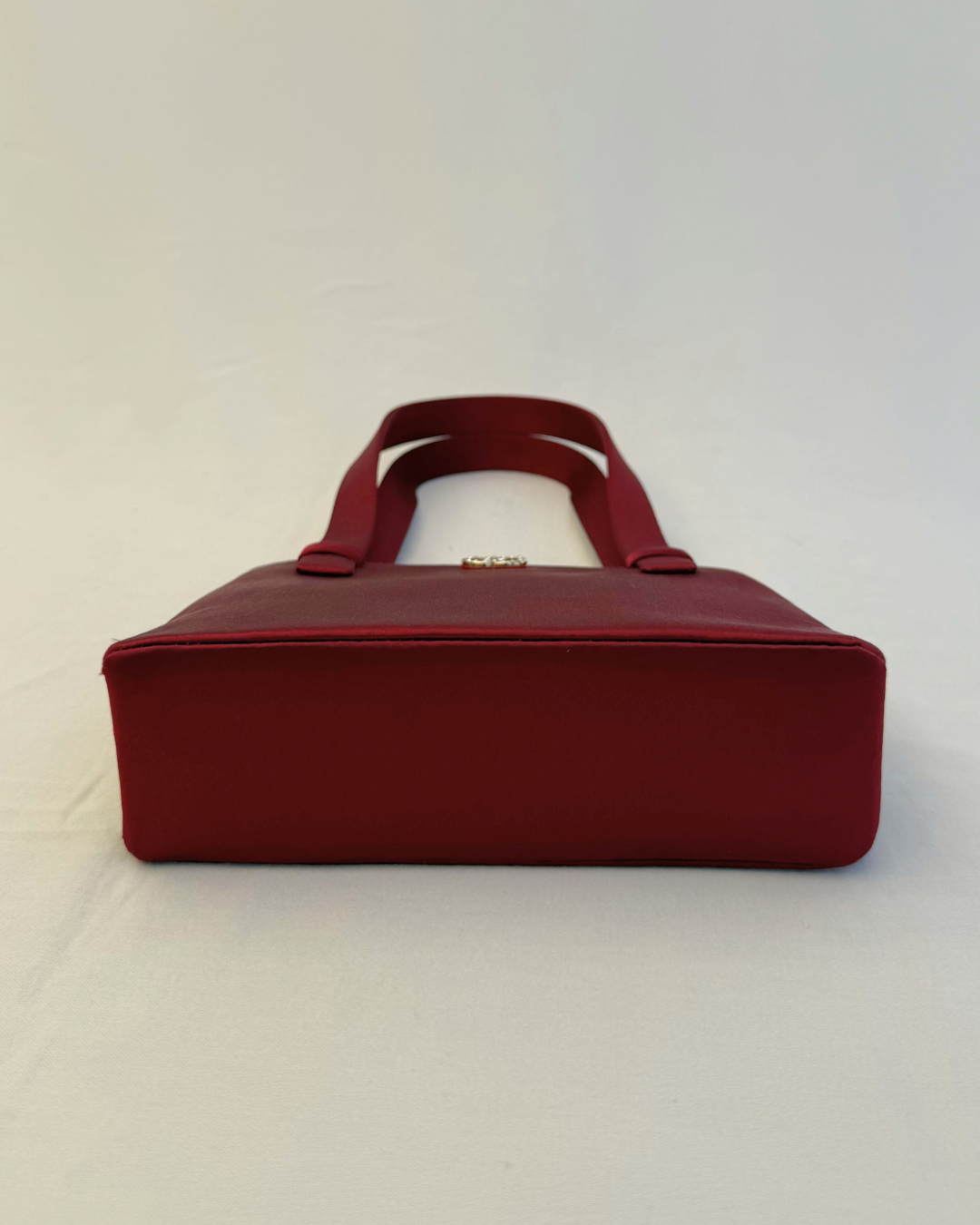 Bottom view of Chanel Rare Vintage 1990's Red Satin Evening Bag vintage handbag on white background