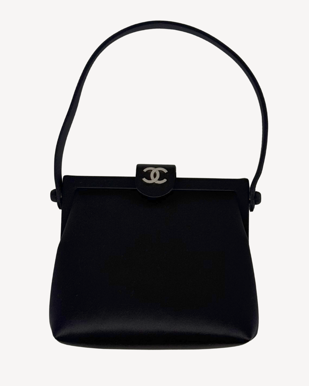 Black handbag with Chanel logo on a white background