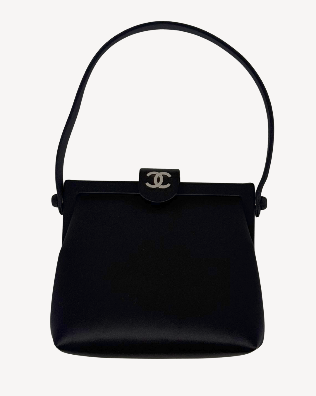 Black handbag with Chanel logo on a white background
