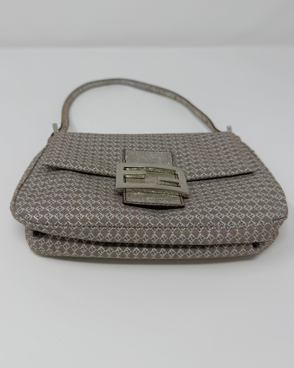 Gray textured Fendi Vintage handbag with a decorative clasp on a white background