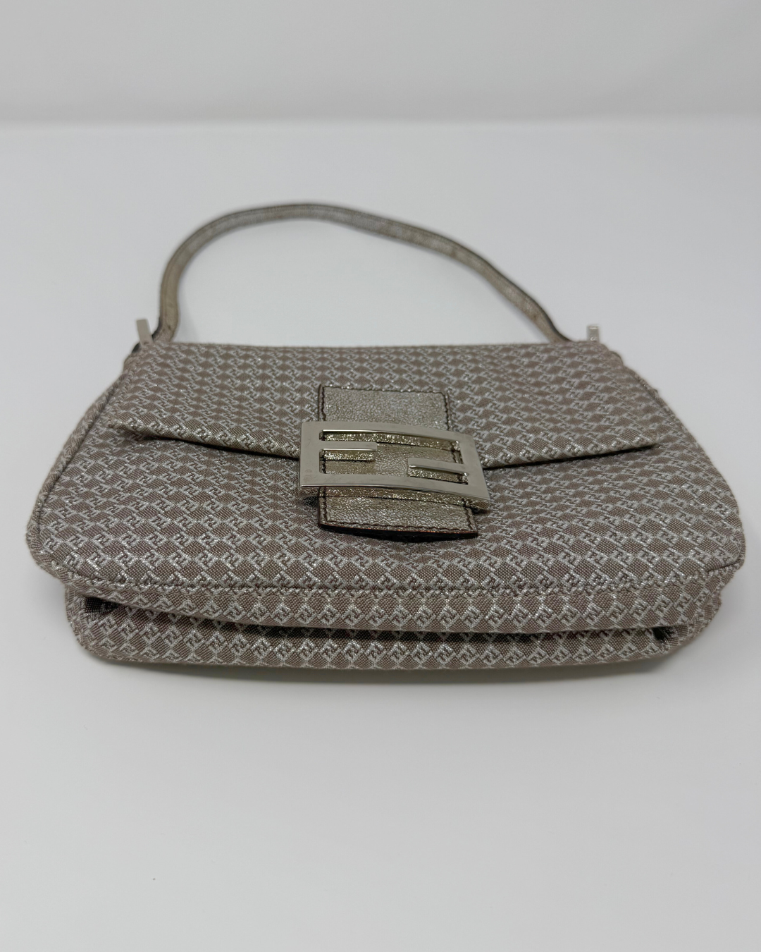 Gray textured Fendi Vintage handbag with a decorative clasp on a white background