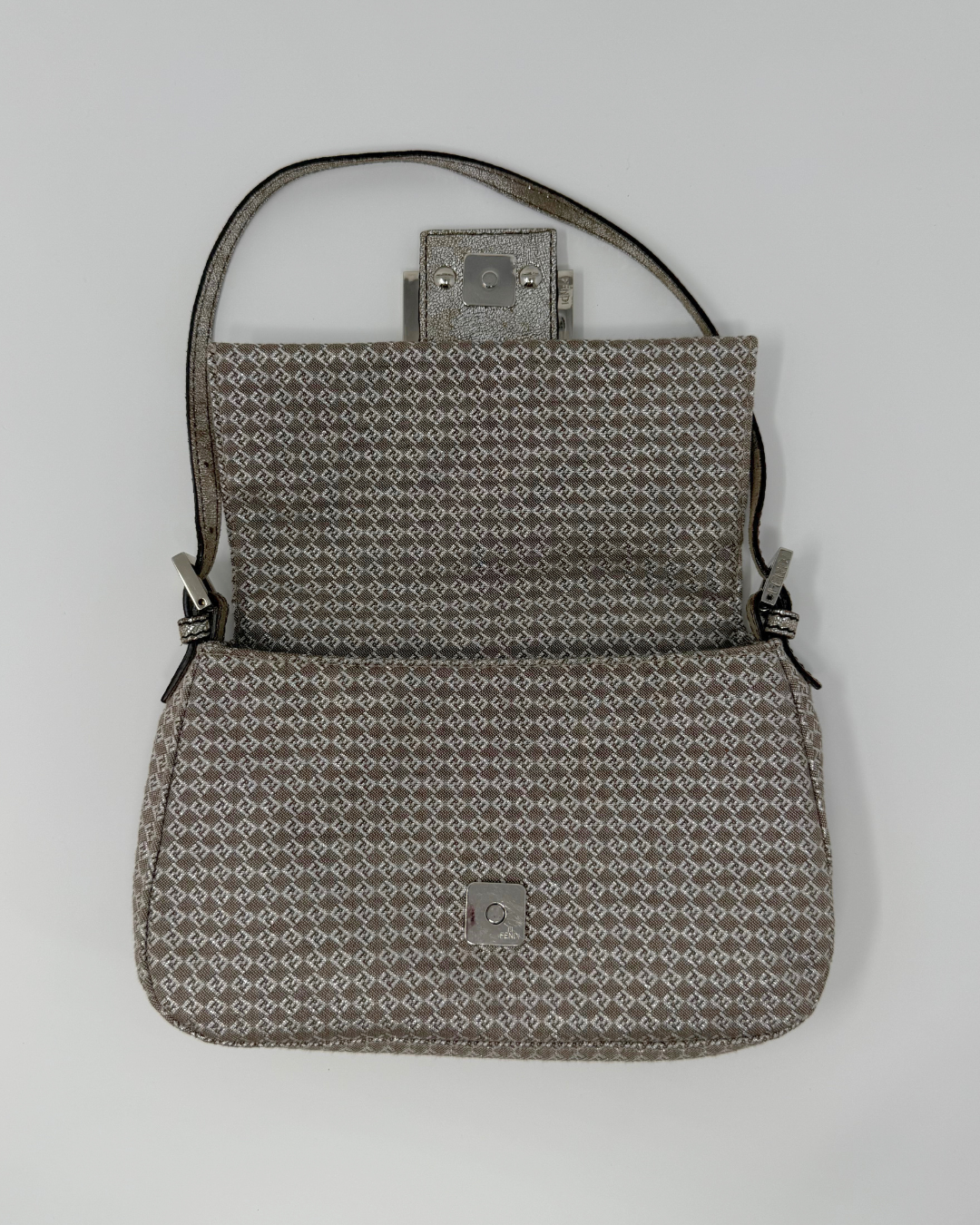 Patterned Fendi vintage handbag on a light gray background