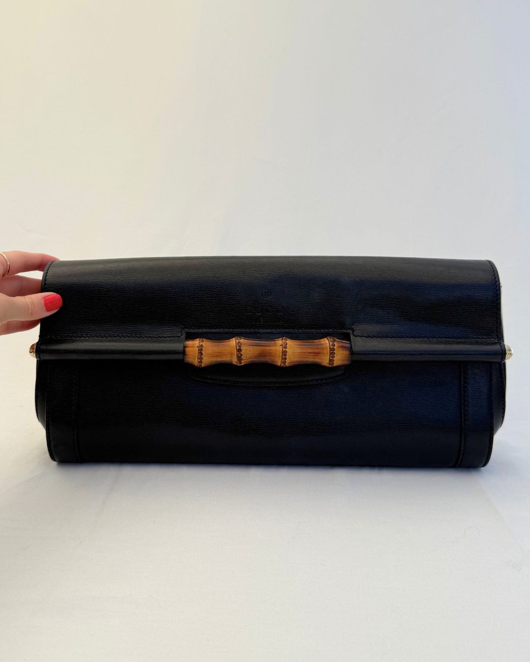 Front view of Gucci Vintage Black Leather & Bamboo Clutch on white background