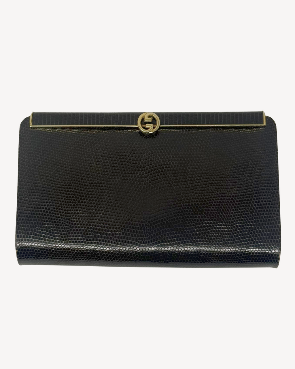 A brown textured clutch bag with a gold-tone interlocking G logo clasp, displayed against a plain white background.