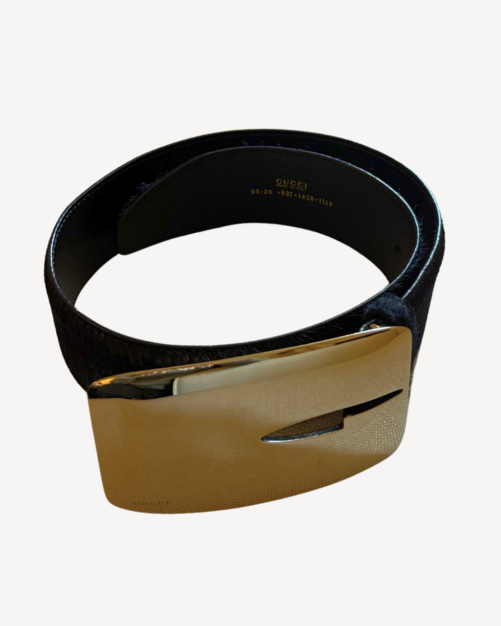 Black belt with a gold buckle on a white background