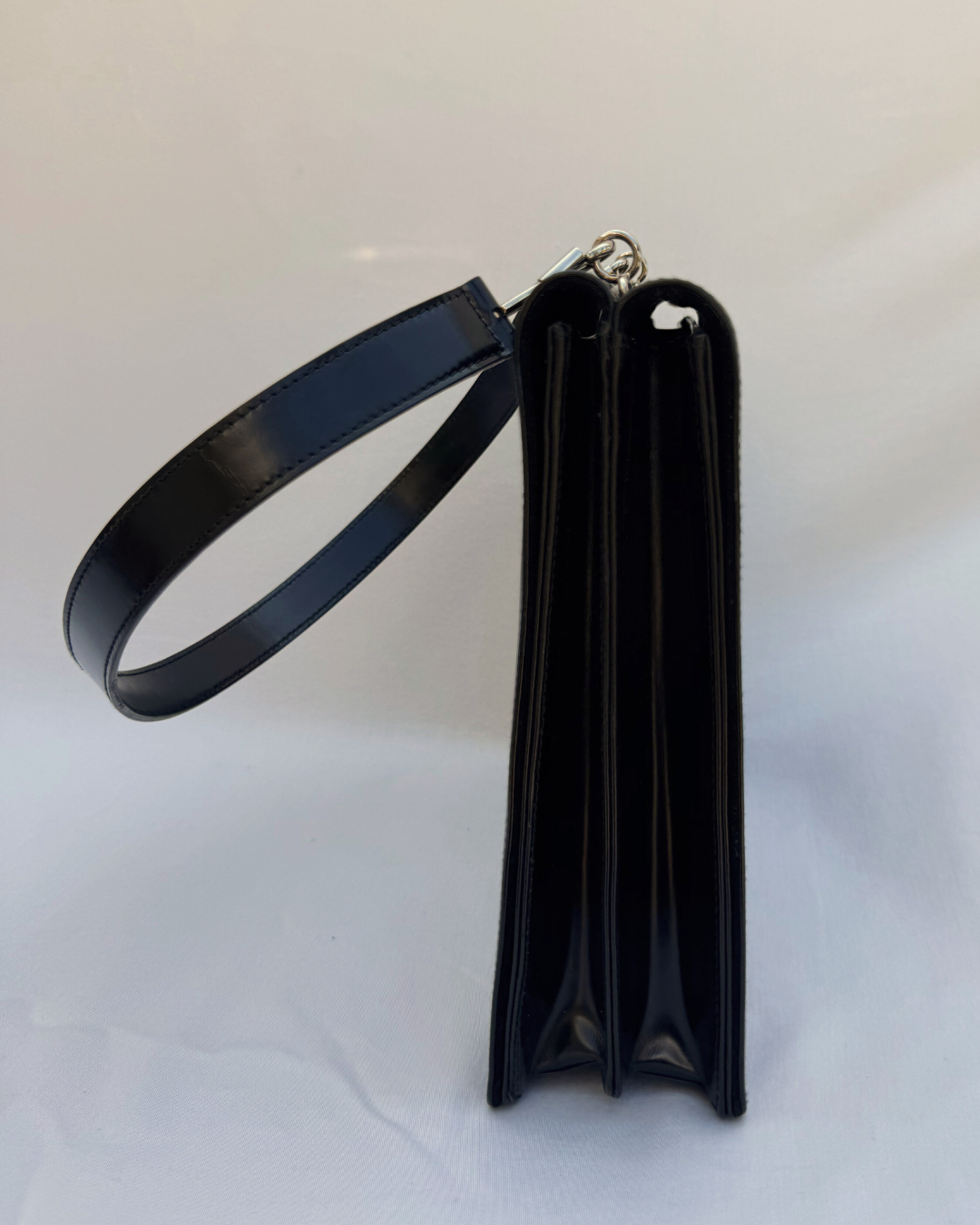 Black leather Gucci by Tom Ford vintage handbag on a white background side view with shoulder strap