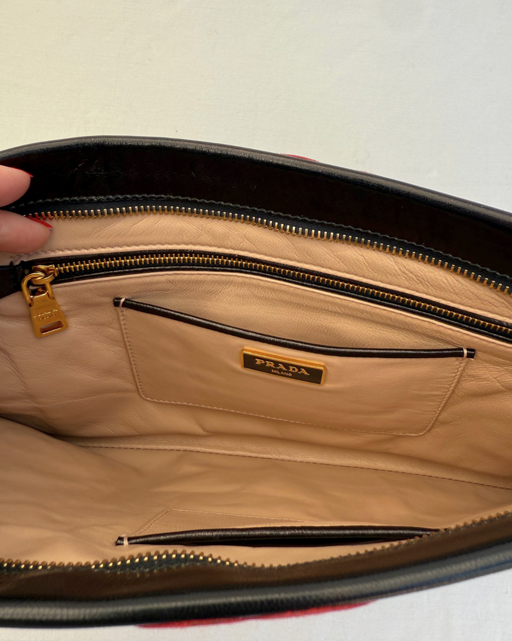 Inside view of Prada Madras Leather Lips Clutch red and black lips graphic vintage handbag