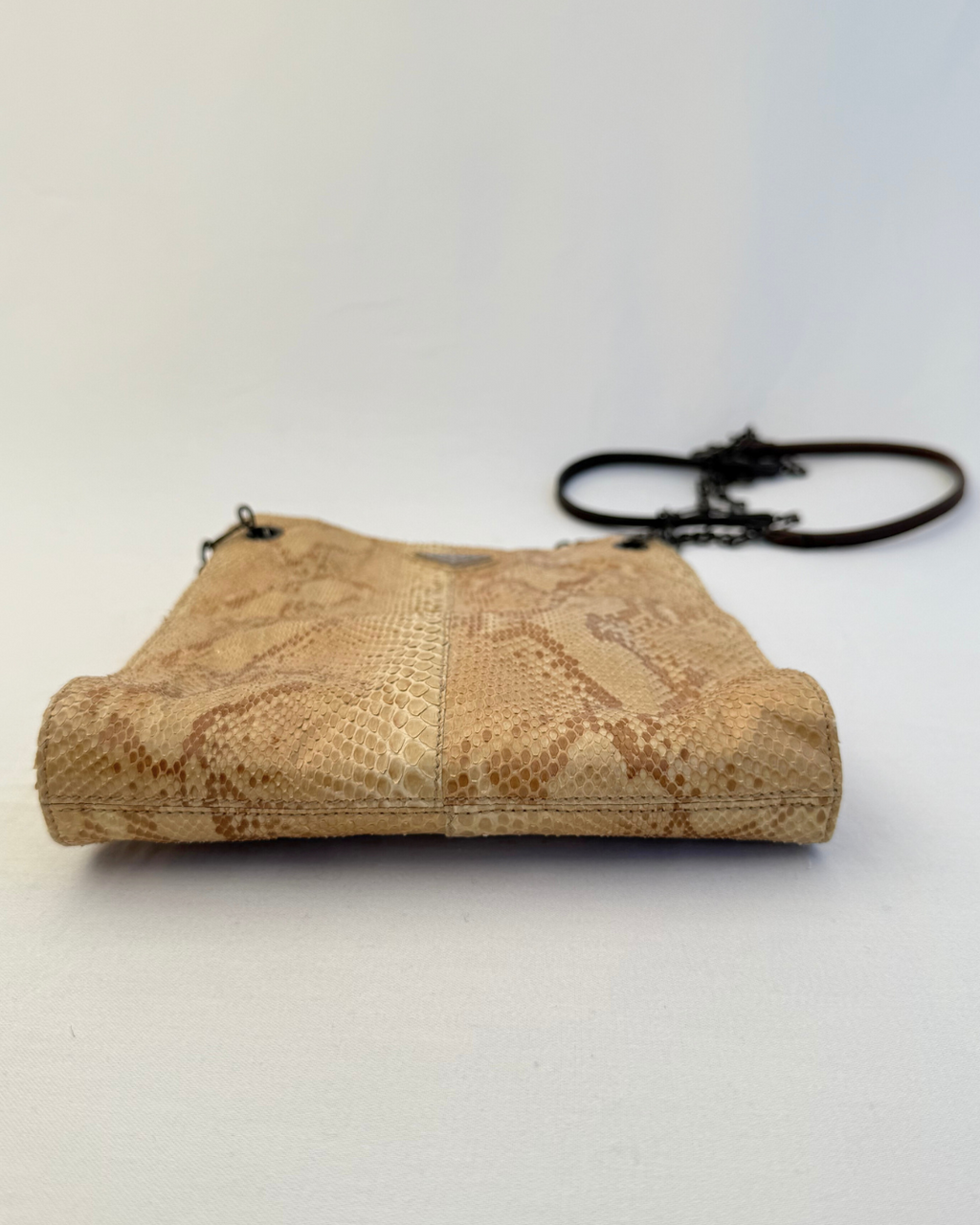 Bottom view of Prada Rare Vintage Enameled Metal Triangle Snakeskin Shoulder Bag on white background