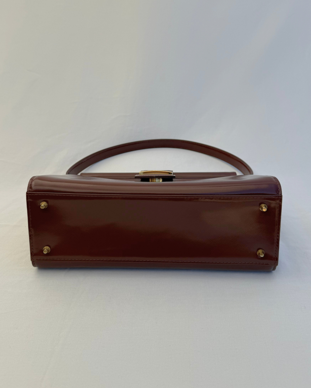 Bottom view of Saint Laurent Vintage Brown Leather Shoulder Bag vintage handbag on white background