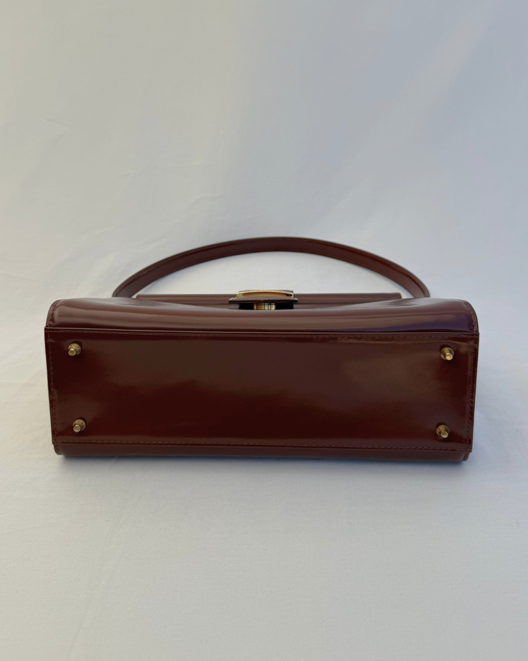 Bottom view of Saint Laurent Vintage Brown Leather Shoulder Bag vintage handbag on white background